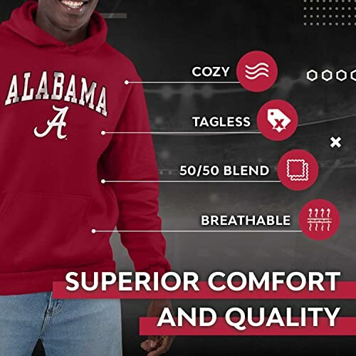 Person wearing an Alabama hoodie highlighting features like cozy, tagless, 50/50 blend, breathable.