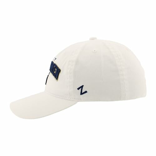 Side view of a white baseball cap with an embroidered logo.